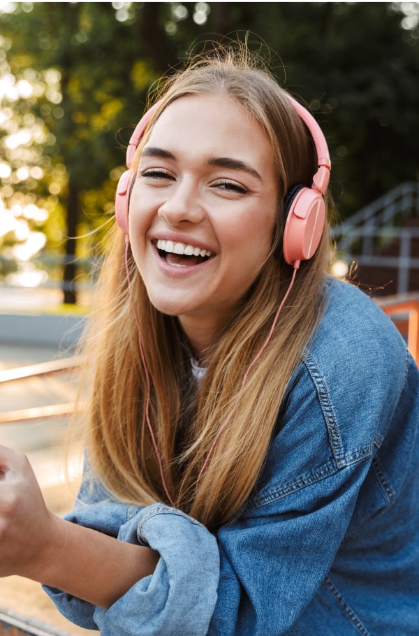 A teenage girls is smiling