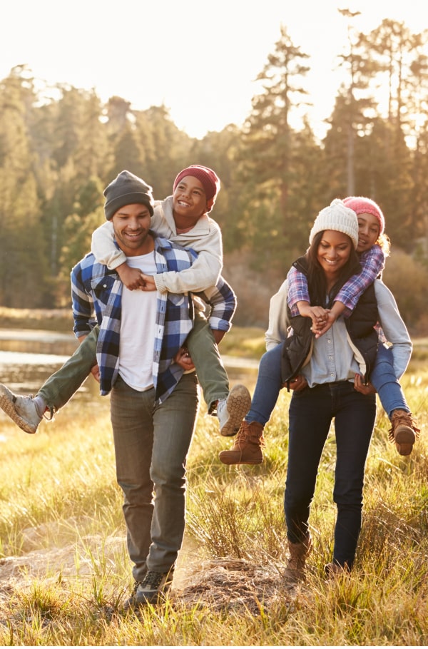 Happy family of four in the nature